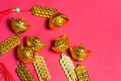 Close-up of chinese new year decorations on pink background