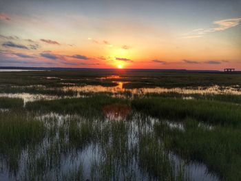 Scenic view of landscape against sky during sunset