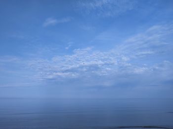 Scenic view of sea against blue sky