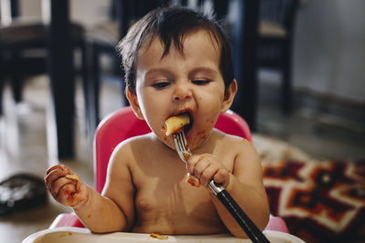 Portrait of cute boy holding food