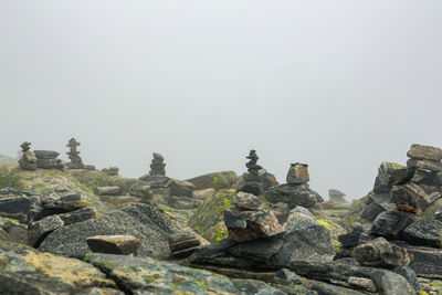 Stack of rocks against clear sky