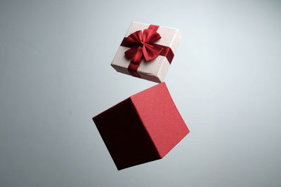 Close-up of red umbrella against white background