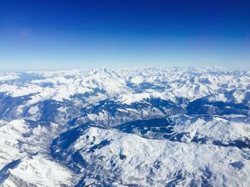 Scenic view of snow covered mountains