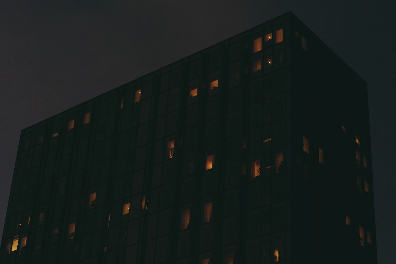 LOW ANGLE VIEW OF BUILDING AT NIGHT
