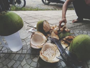 High angle view of man and fruits on table