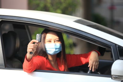 Portrait of woman in car