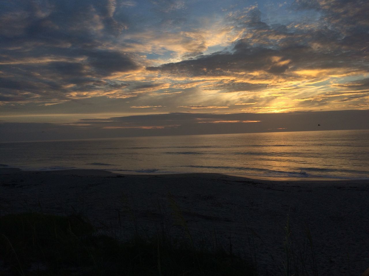 sunset, sea, scenics, nature, beauty in nature, tranquility, water, beach, tranquil scene, sky, horizon over water, idyllic, no people, cloud - sky, outdoors, silhouette, sun, sand, travel destinations, day