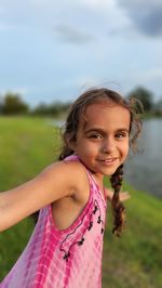 5 year old girl happy by water