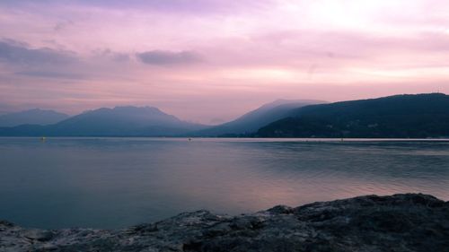 Scenic view of lake against sky during sunset