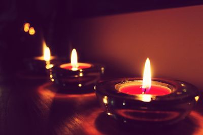 Close-up of illuminated tea light candles