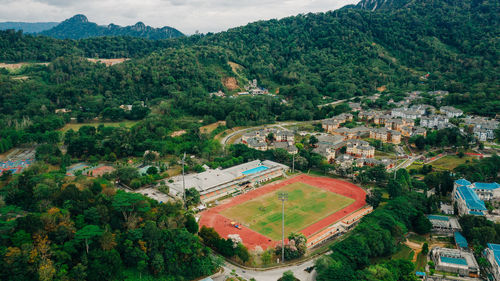 Aerial view of stadium against trees