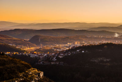 Scenic view of landscape against sky at sunset