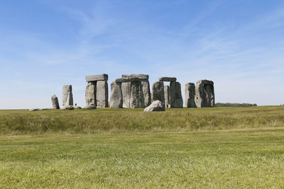 Built structure on landscape against the sky