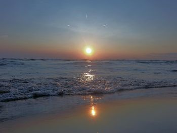 Scenic view of sea at sunset