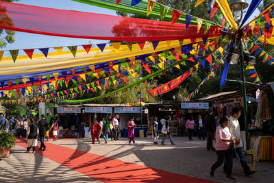 Group of people walking in market