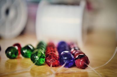 Close-up of colorful beads on table