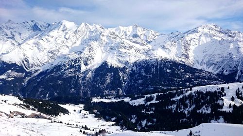 Scenic view of snow covered mountains