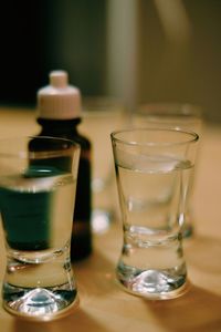 Close-up of drinks in glasses on table