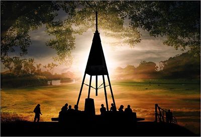 Silhouette of people at sunset