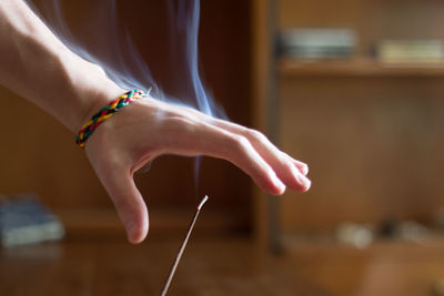 Cropped hand of man over