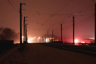 Street against sky during sunset