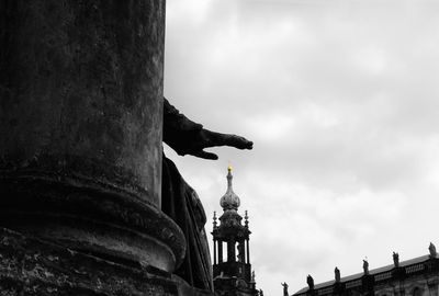 Low angle view of historic building against cloudy sky