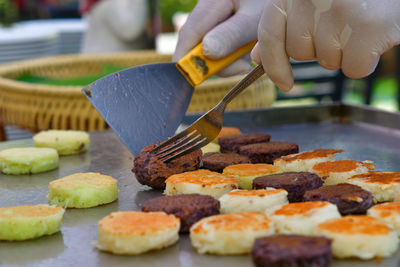 Cropped image of person preparing food