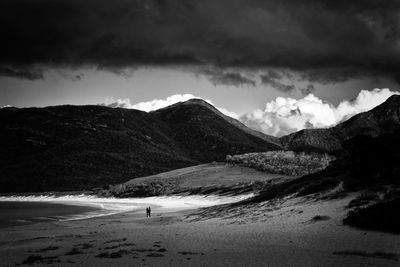 Scenic view of mountains against cloudy sky at freycinet national park