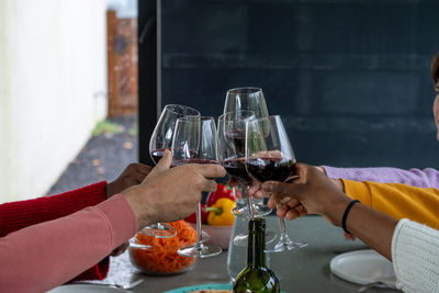 Cropped hand of man preparing food on table