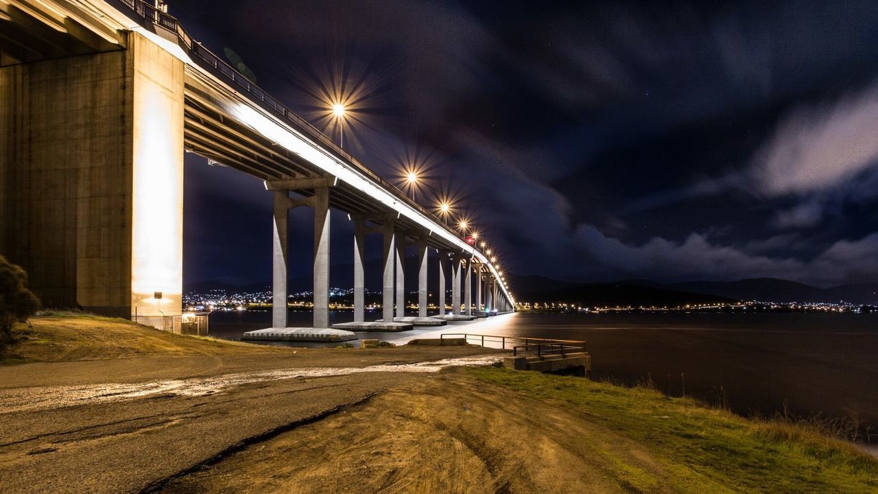 built structure, architecture, transportation, bridge - man made structure, connection, night, illuminated, sky, engineering, river, arch, water, bridge, arch bridge, long exposure, building exterior, road, city, motion, outdoors