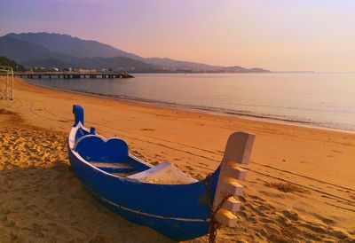 Scenic view of beach against sky during sunset