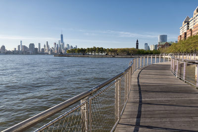 View of bridge over river against buildings