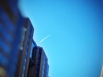 Low angle view of built structure against clear blue sky