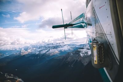 Aerial view of snowcapped mountains against sky