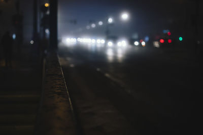 Surface level of railroad tracks on road at night