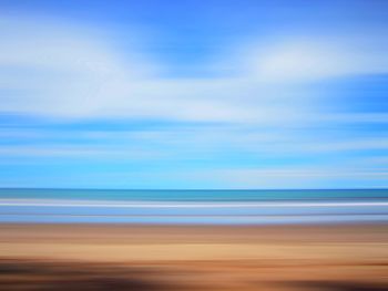 Scenic view of sea against blue sky