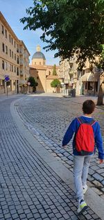 Rear view of boy on building