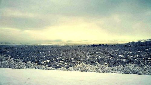 Scenic view of landscape against cloudy sky