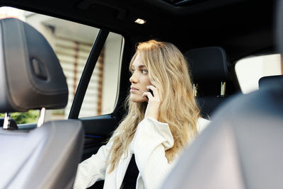 Portrait of woman in car