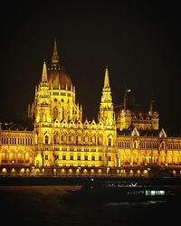 Low angle view of illuminated building at night