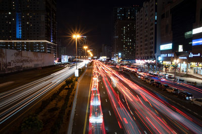 High angle view of light trails on road at night