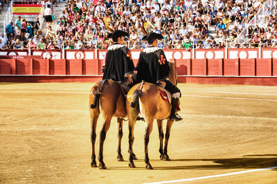 Group of people riding horse