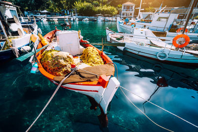 Boats moored at harbor