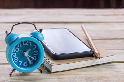 Close-up of clock on table