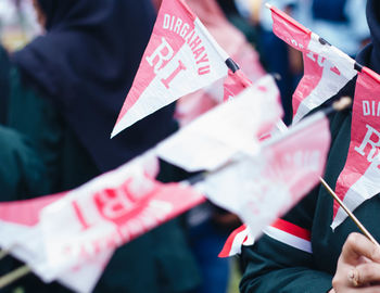 Close-up of hand holding flag