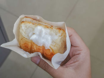 Close-up of hand holding ice cream