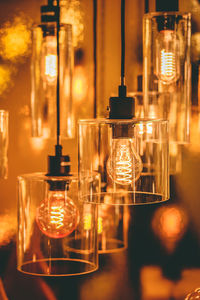 Close-up of illuminated light bulbs in darkroom