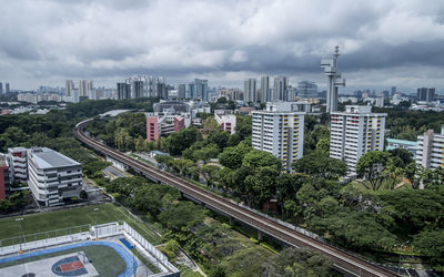 Cityscape against cloudy sky