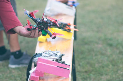 Close-up of hand holding drone