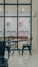 Empty chairs and tables in cafe